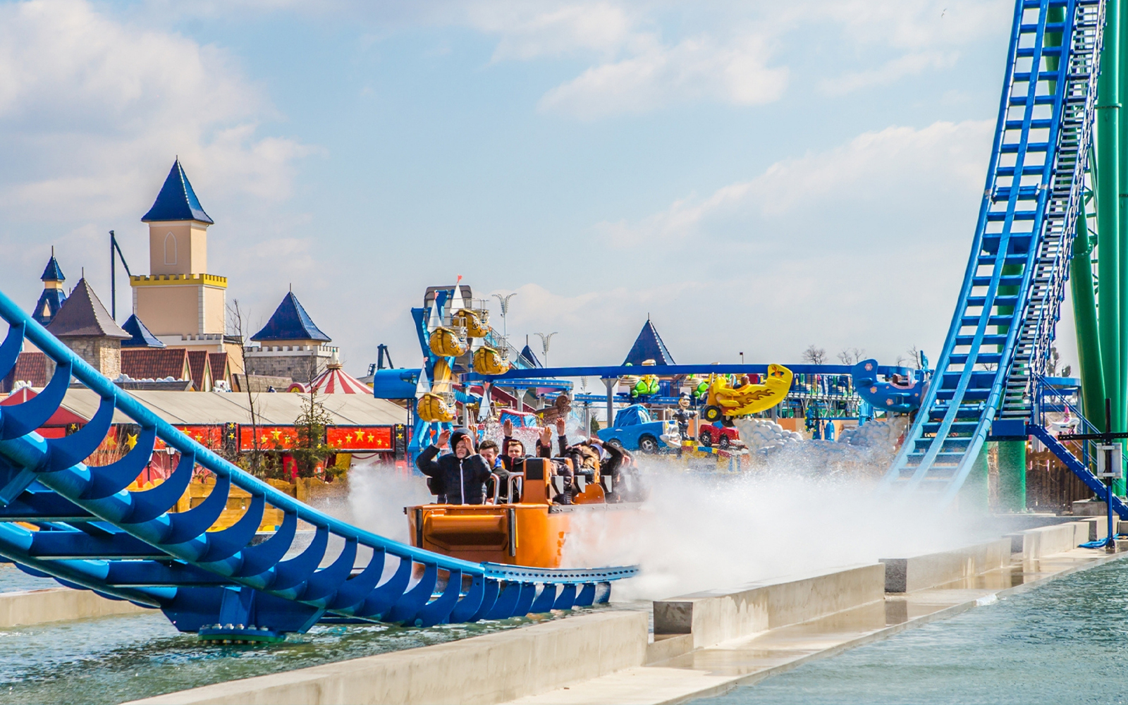 Roller coaster speeding through loops at Energylandia amusement park, Poland.