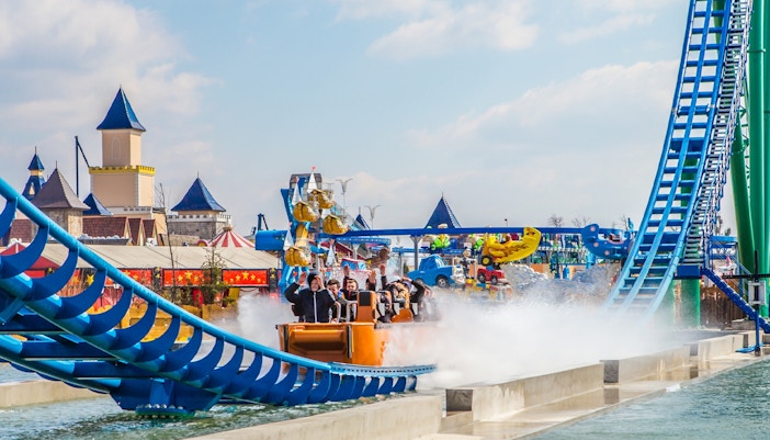 Roller coaster speeding through loops at Energylandia amusement park, Poland.