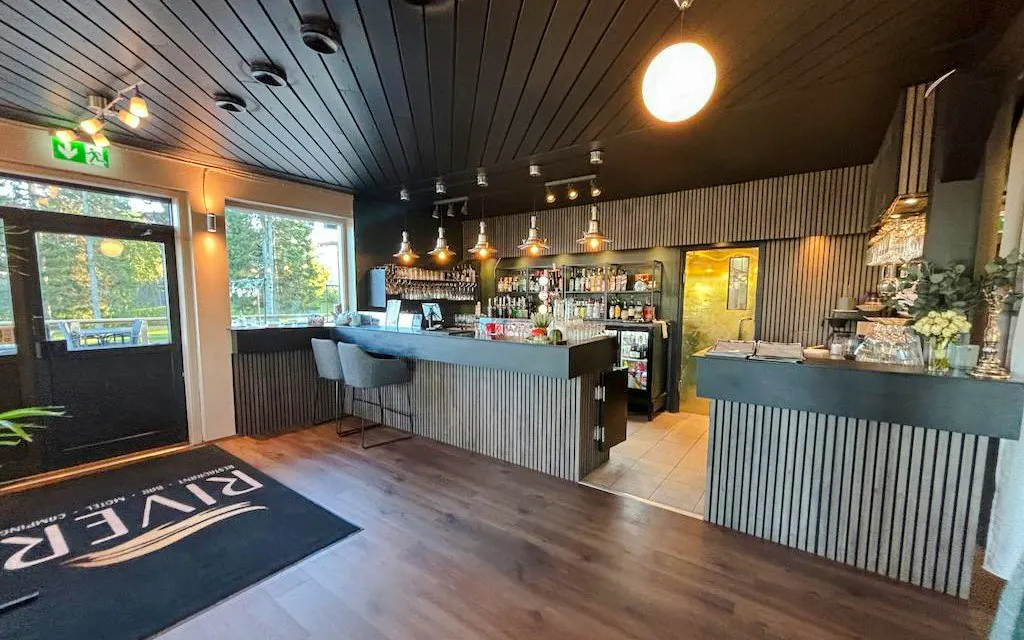 Restaurant interior with bar seating during lunch for Icebreaker Cruise & Ice Floating Experience.