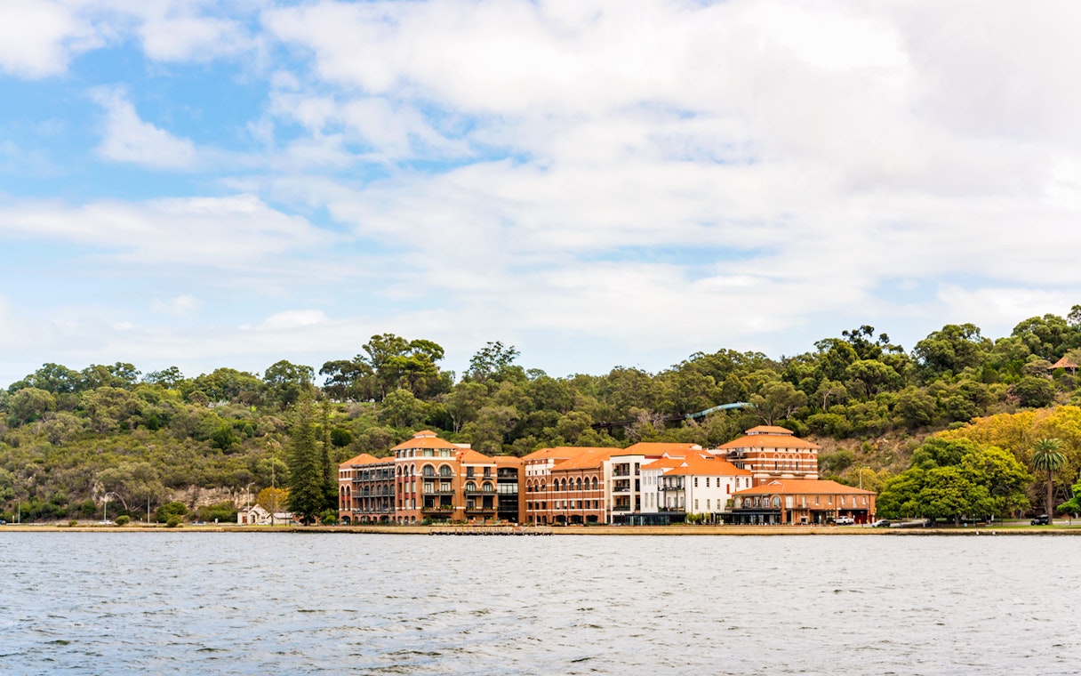 Swan Brewery on Swan River with surrounding greenery in Perth, Australia.