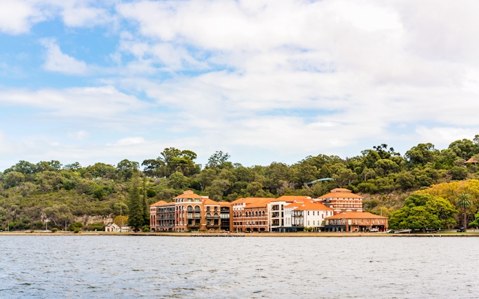 Swan Brewery on Swan River with surrounding greenery in Perth, Australia.