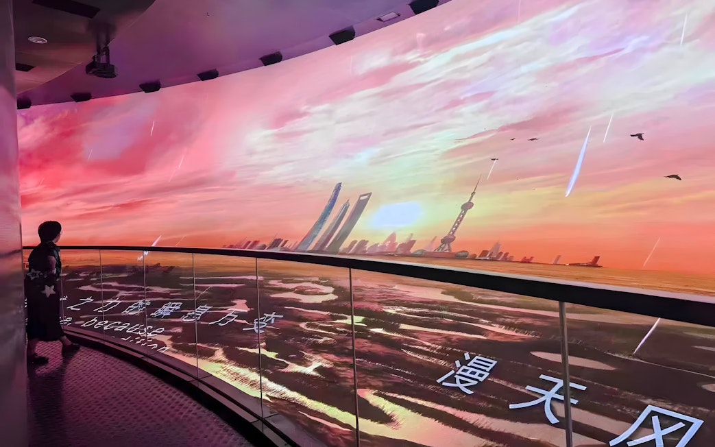 Shanghai Urban History Development Exhibition Hall display with Oriental Pearl Tower view.