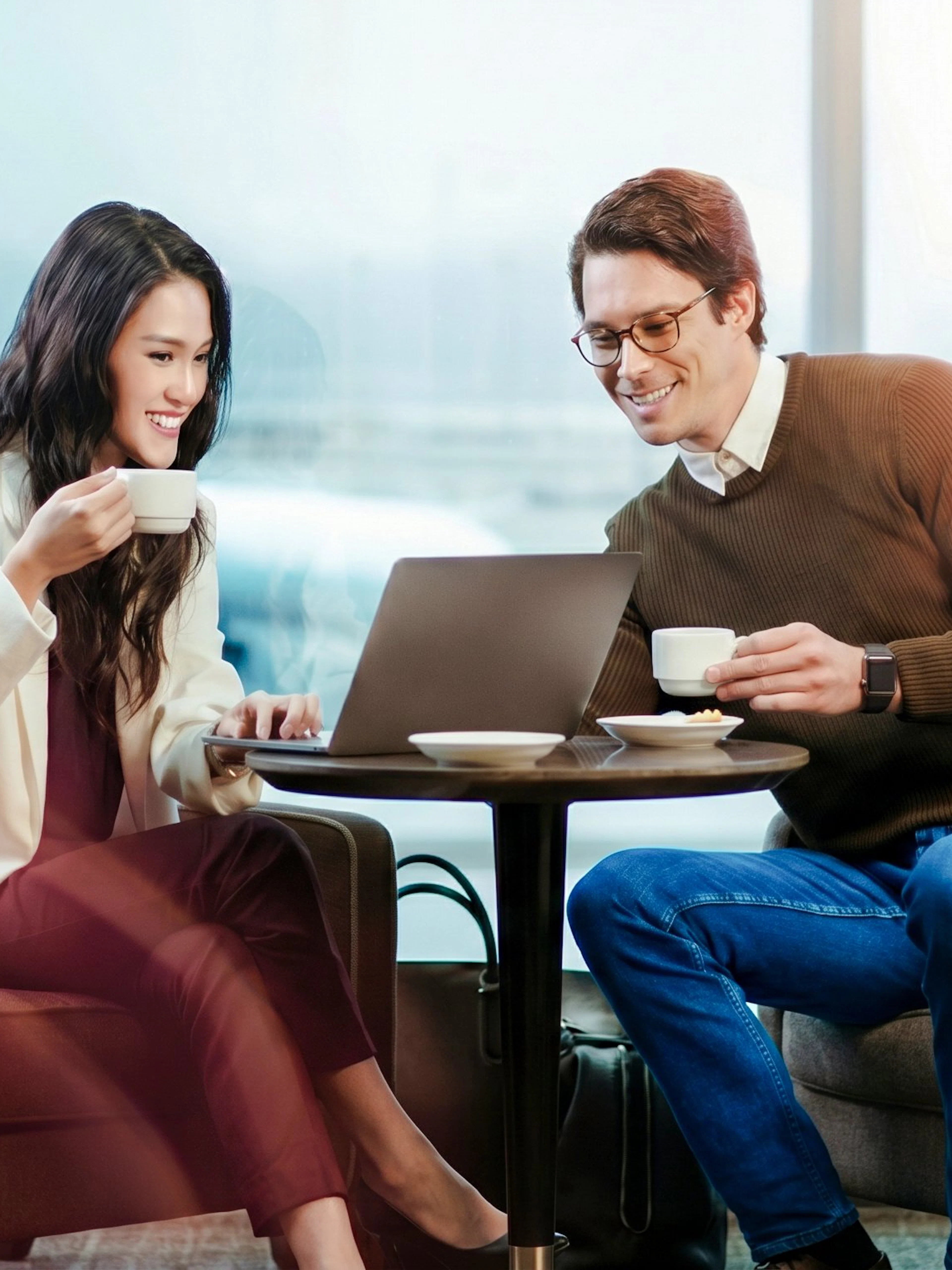 Couple enjoying coffee in VIP Lounge by MERA Roof, Terminal 3, Cancún International Airport.