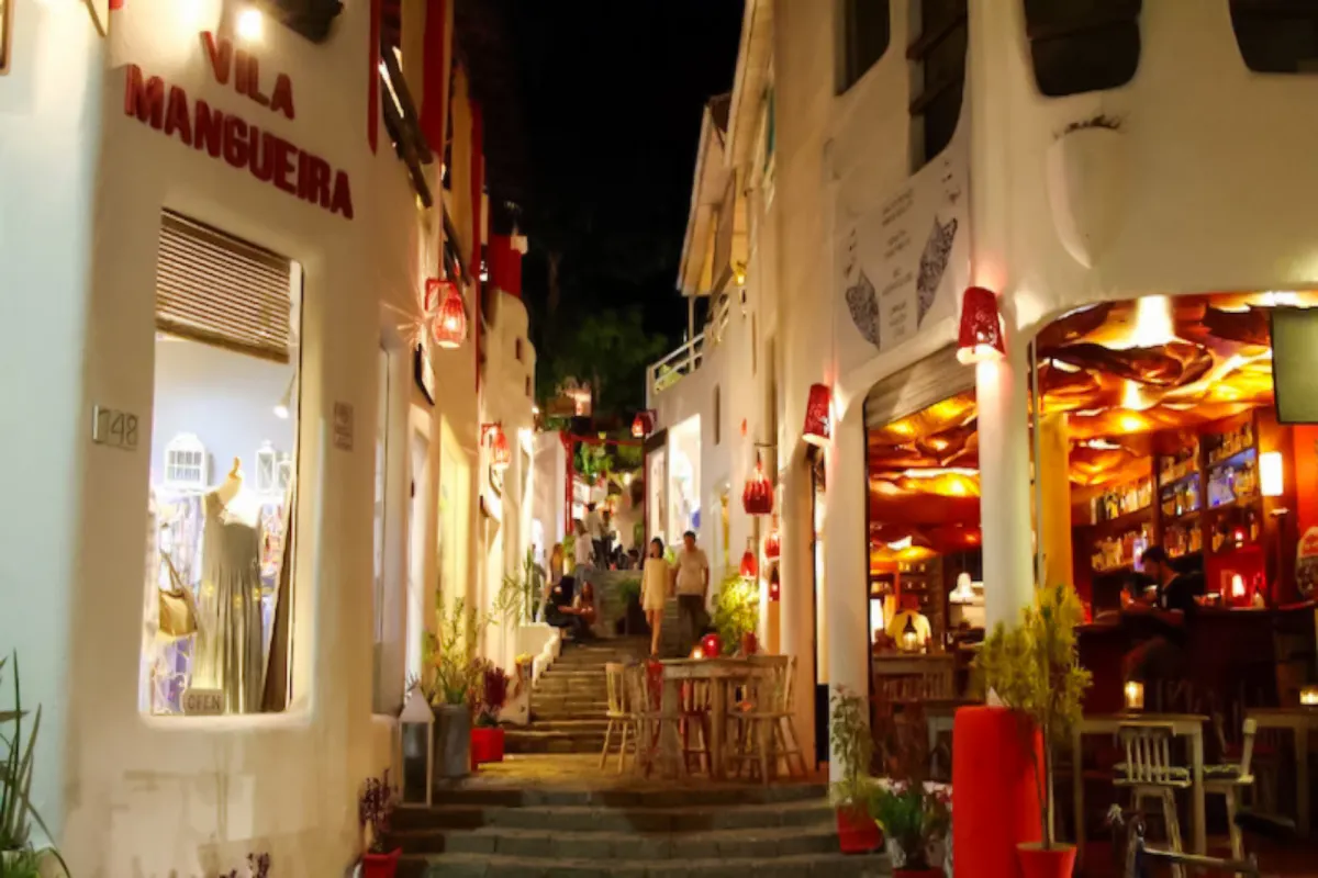 Evening view of Pipa Village street with shops and cafes, Sao Paulo nightlife.