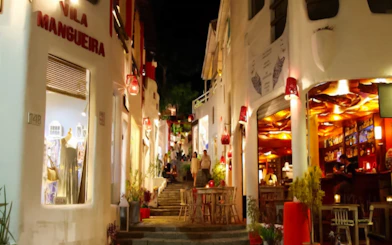 Evening view of Pipa Village street with shops and cafes, Sao Paulo nightlife.