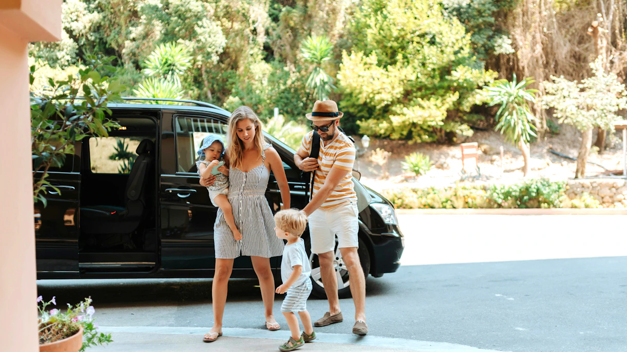 Family with toddlers preparing for airport transfer from Borobudur.