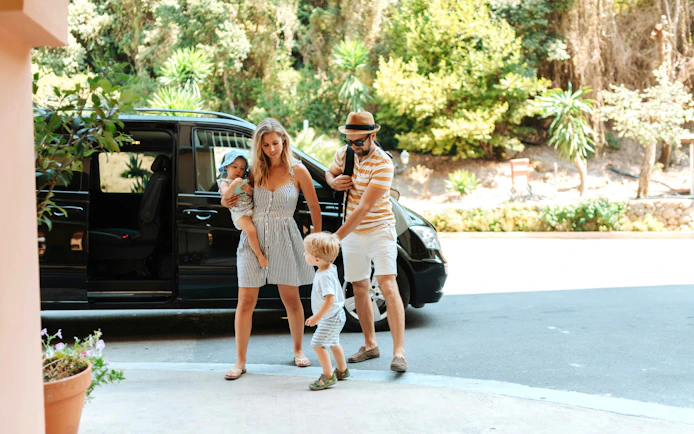 Family with toddlers preparing for airport transfer from Borobudur.
