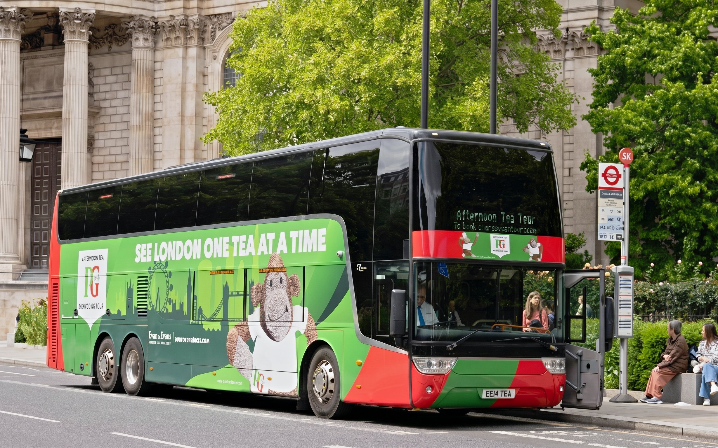 Double-decker bus for Classic London Sightseeing Tour parked near historic building.