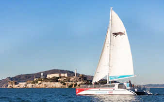 Sailing catamaran near Alcatraz Island in San Francisco Bay.