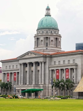 National Gallery Singapore with dome and columns, banners for modern art exhibition.