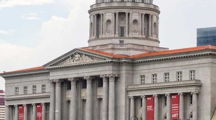 National Gallery Singapore with dome and columns, banners for modern art exhibition.
