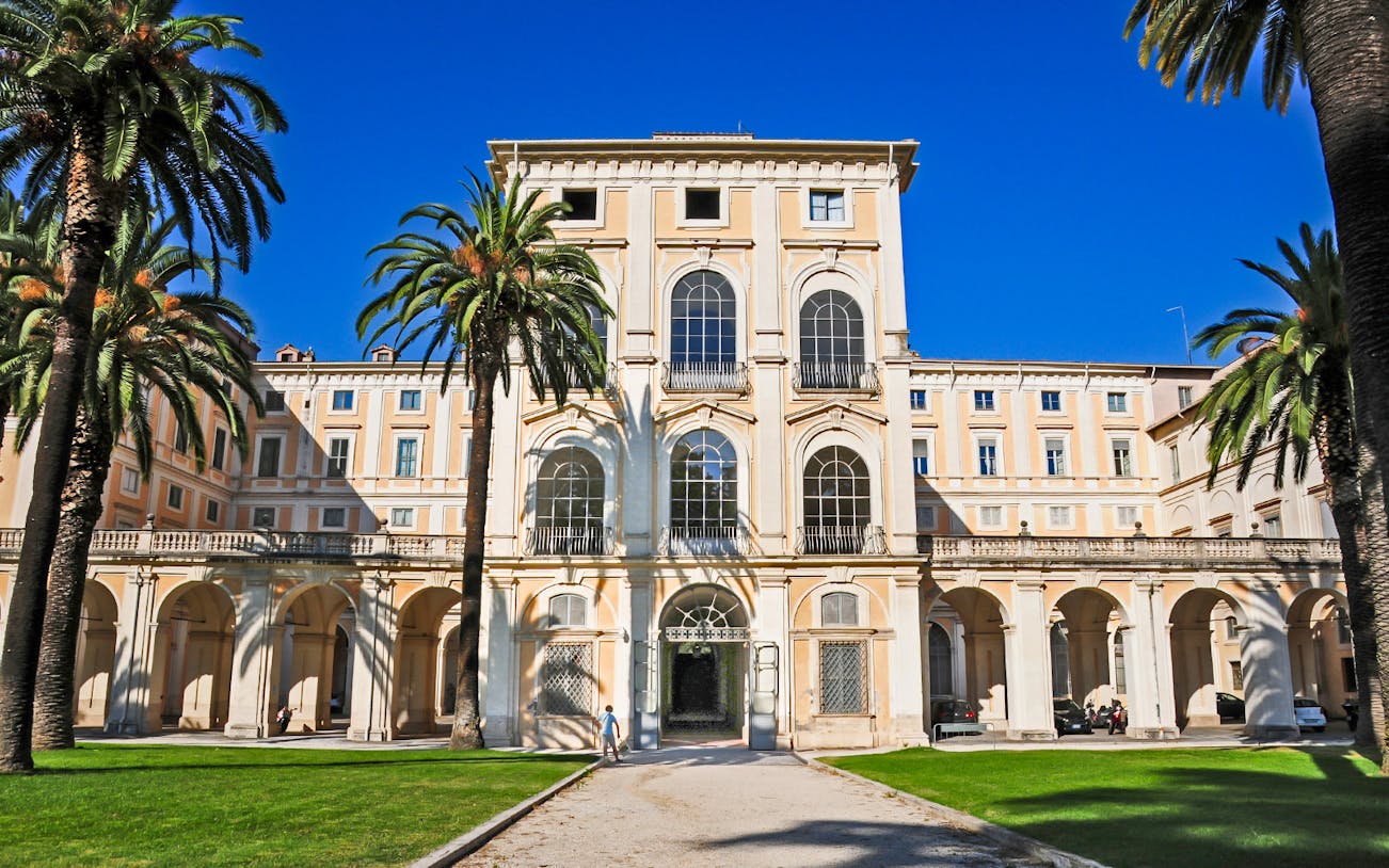 Galleria Corsini entrance with palm trees in Rome, Italy.