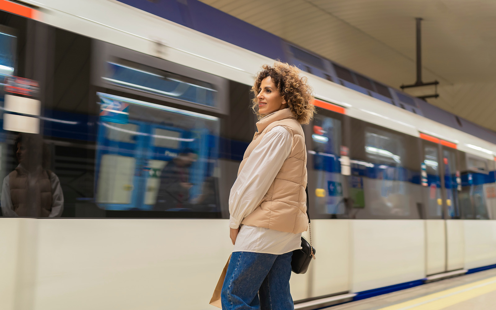train station exterior with people walking and historic architecture.