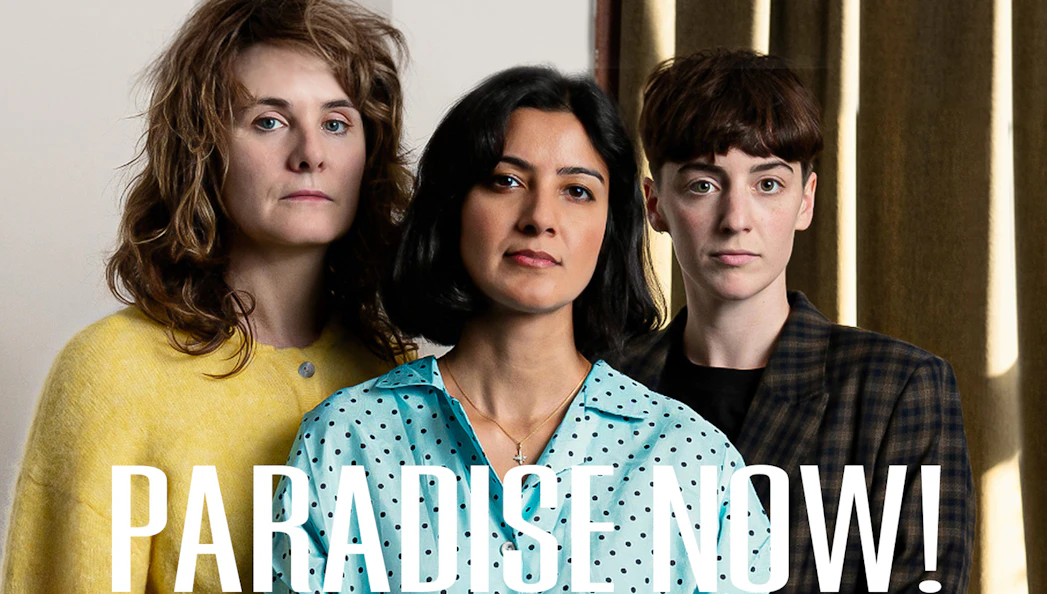 Three people standing together with the text "Paradise Now!" in front.