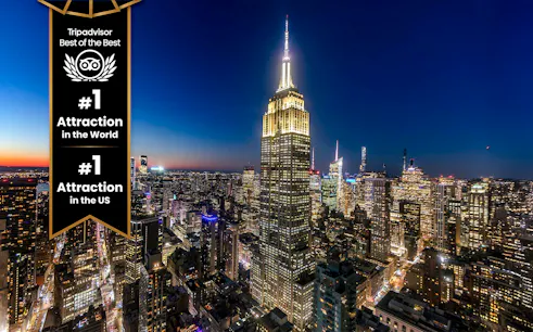 Empire State Building illuminated at night in New York City skyline.