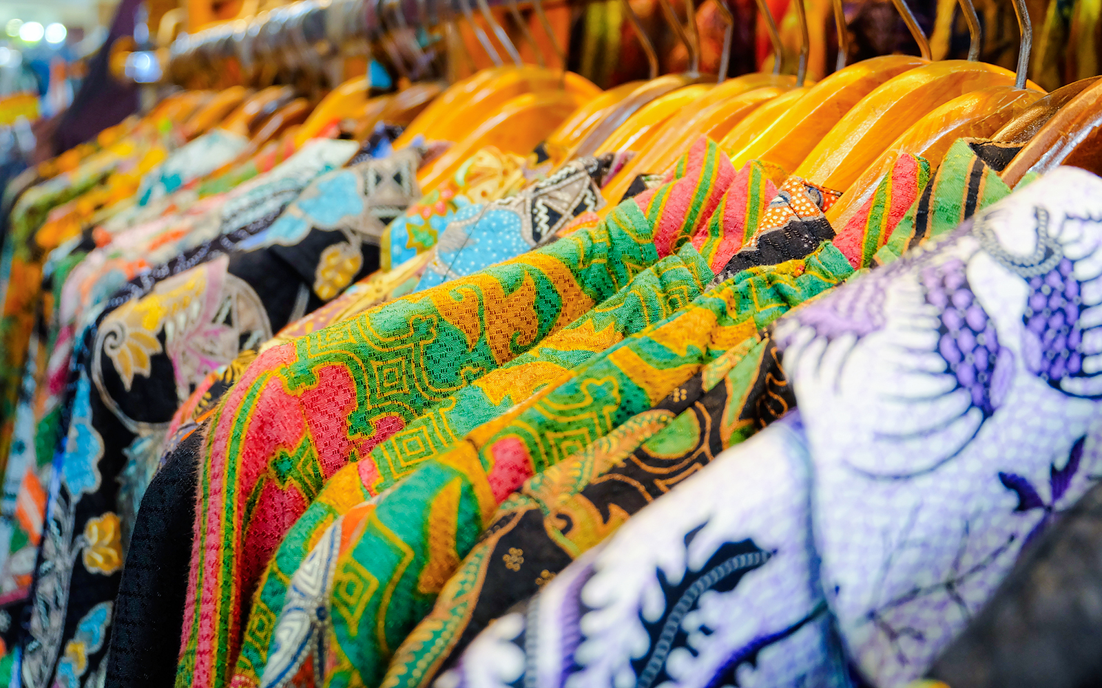 Colorful batik fabrics on display at Batik Boutique gift shop, Malaysia.