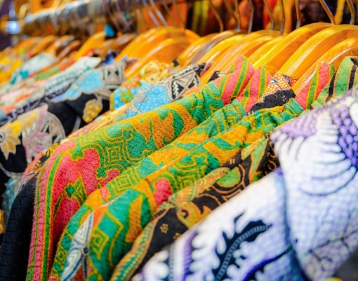 Batik Boutique gift shop interior with colorful fabric displays, Malaysia.