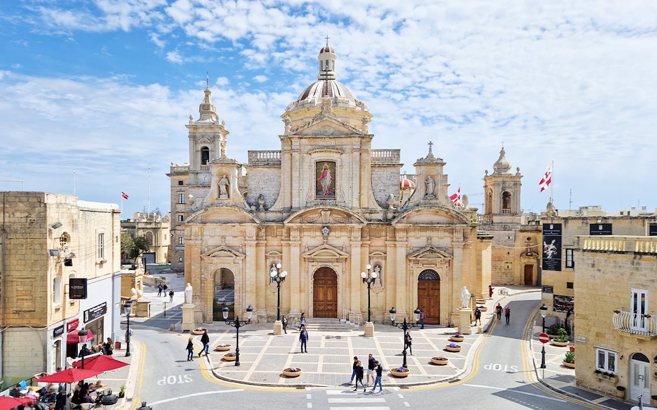 Mdina Cathedral facade with people walking, part of 2.5-hour guided tour of Mdina and Rabat.
