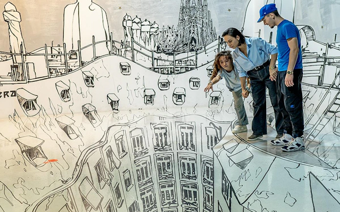 Visitors exploring optical illusion art at Big Fun Museum, Barcelona.