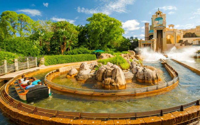 Journey to Atlantis water ride at SeaWorld Orlando with boat on winding track.