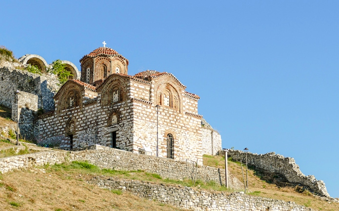 Old church with red-tiled roof in the Castle of Berat, Albania.