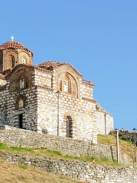 Old church with red-tiled roof in the Castle of Berat, Albania.