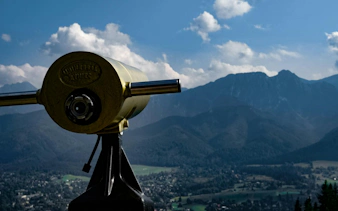 Viewing telescope overlooking Tatra Mountains in Zakopane, Poland.