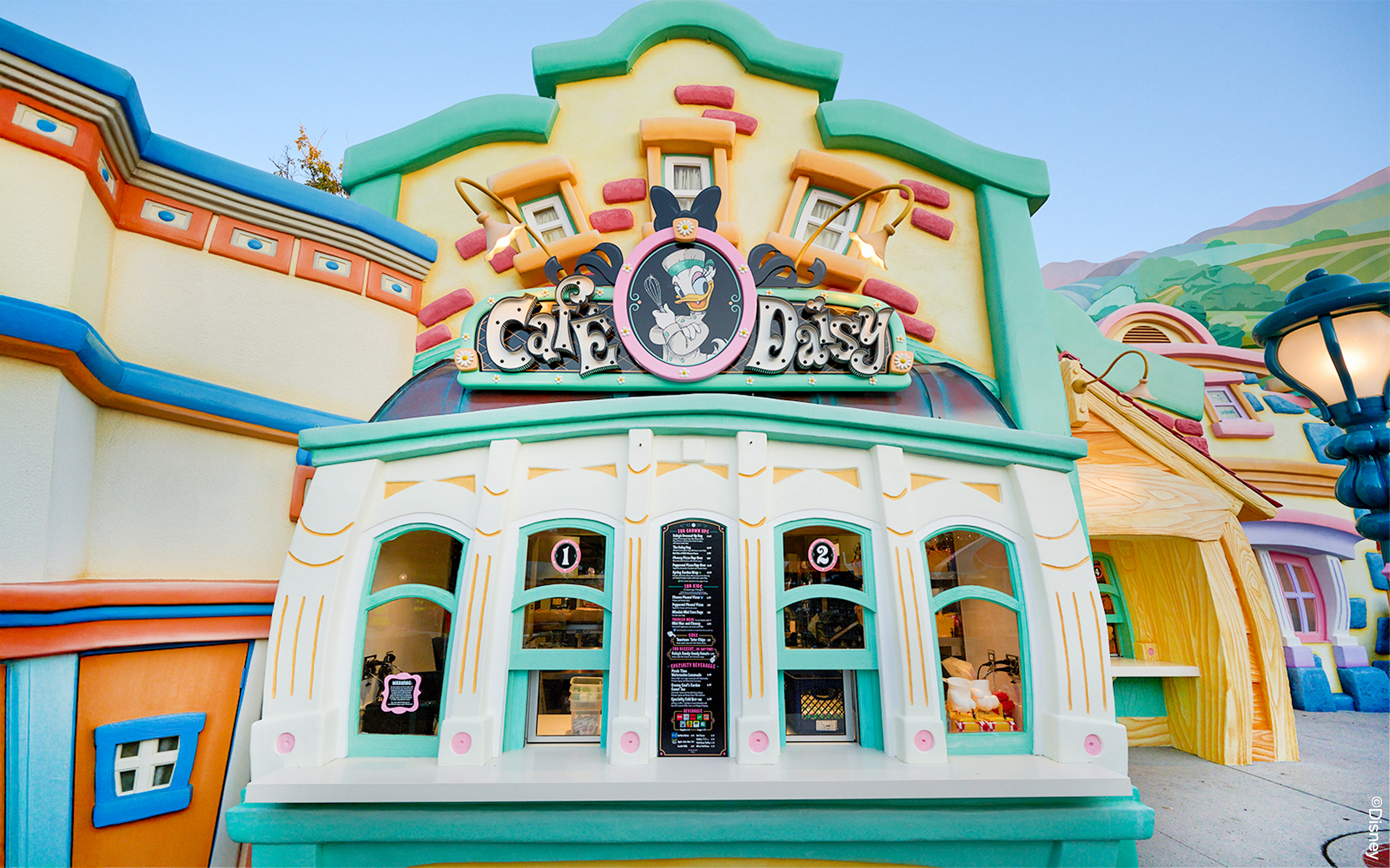 Cafe Daisy entrance with colorful facade at Disneyland Park, California.