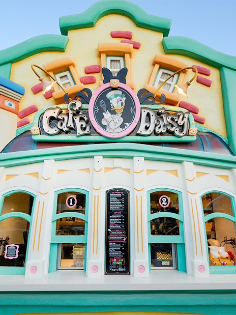 Cafe Daisy entrance with colorful facade at Disneyland Park, California.