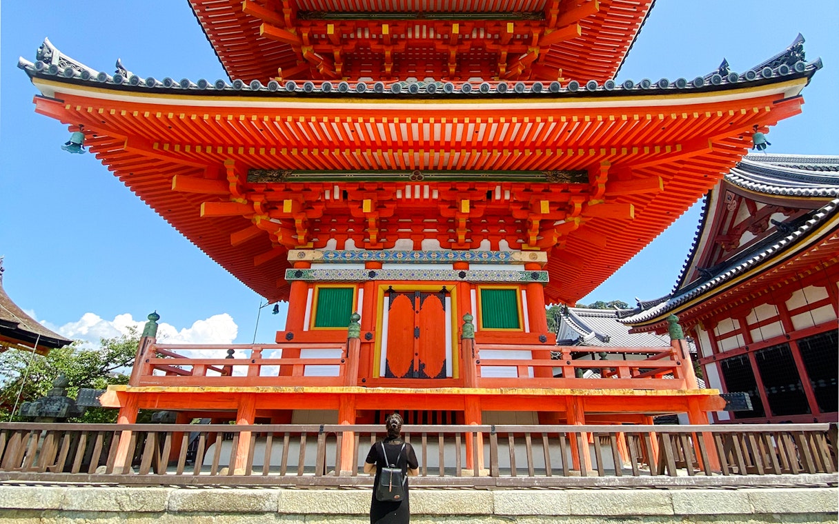 Kiyomizu-dera temple with vibrant red architecture in Kyoto, Japan.