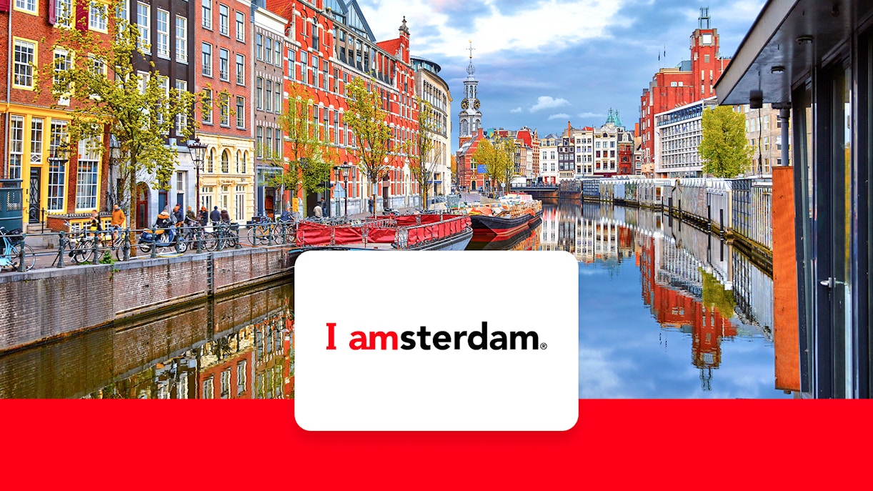 Amsterdam canal view with historic buildings and bicycles, promoting I Amsterdam City Card.