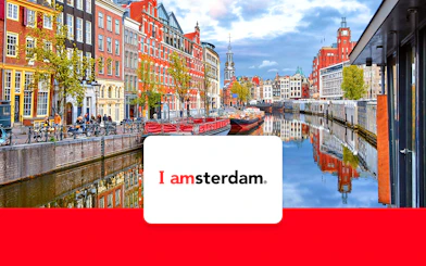 Amsterdam canal view with historic buildings and bicycles, promoting I Amsterdam City Card.