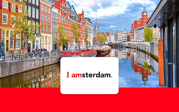 Amsterdam canal view with historic buildings and bicycles, promoting I Amsterdam City Card.