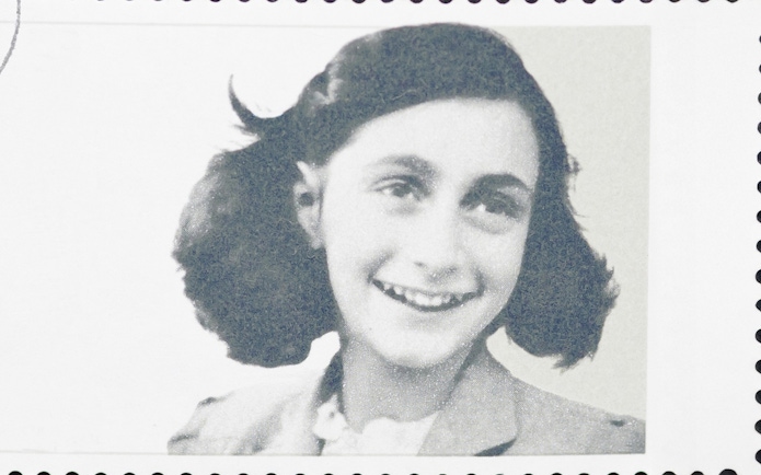 Young girl smiling on a postage stamp.