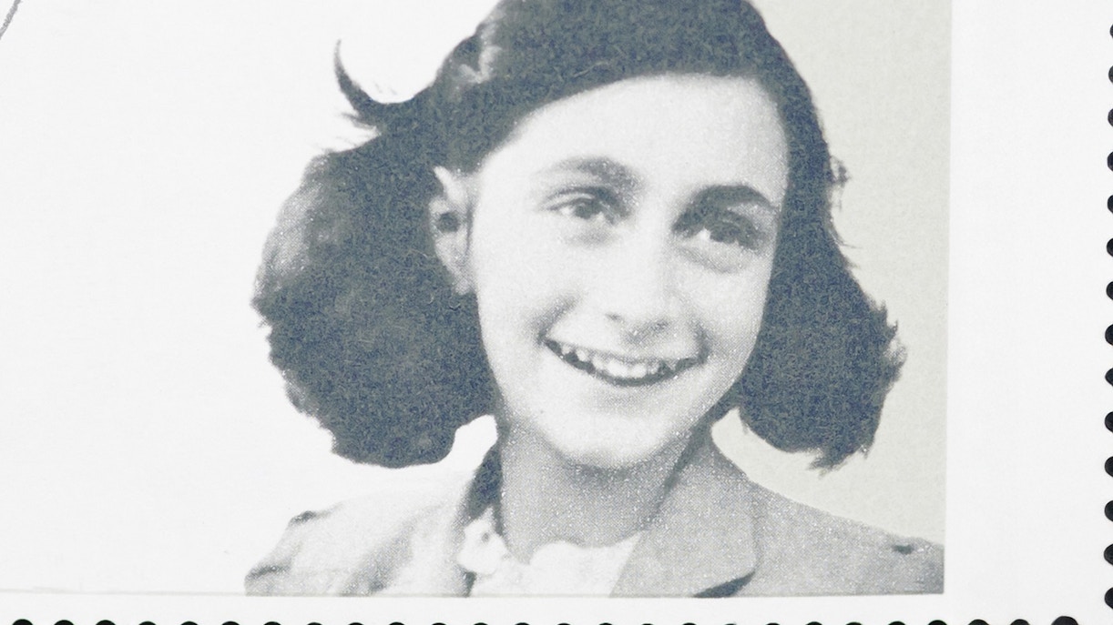 Young girl smiling on a postage stamp.
