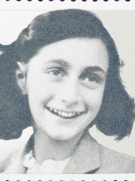 Young girl smiling on a postage stamp.