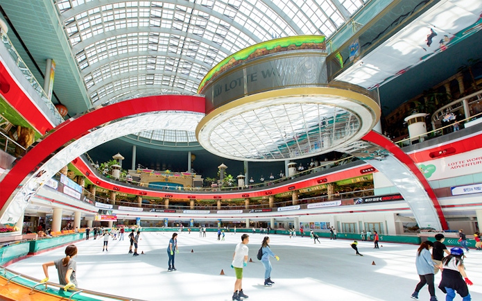 Skaters enjoying the indoor rink at Lotte World in Seoul, South Korea.