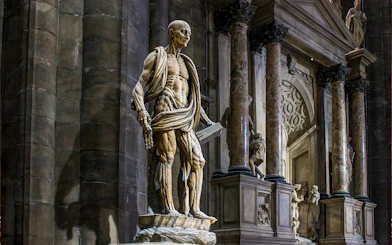 Statue of St. Bartholomew Flayed Alive inside Duomo Milan Cathedral, Italy.