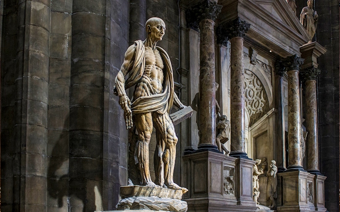 Statue of St. Bartholomew Flayed Alive inside Duomo Milan Cathedral, Italy.