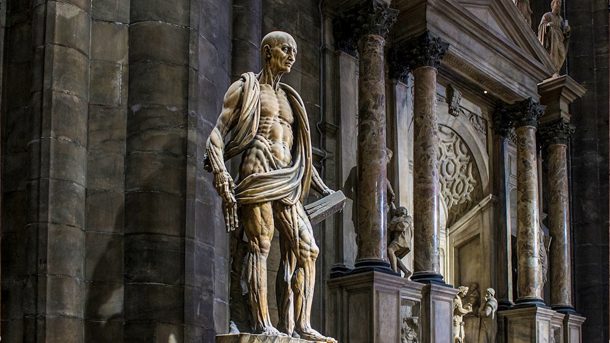 Statue of St. Bartholomew Flayed Alive inside Duomo Milan Cathedral, Italy.