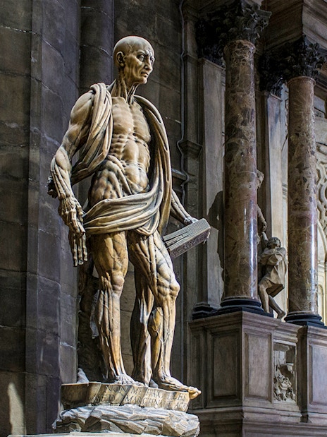 Statue of St. Bartholomew Flayed Alive inside Duomo Milan Cathedral, Italy.