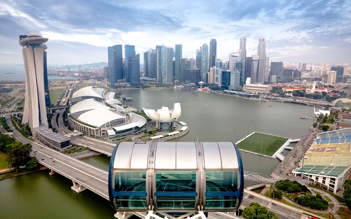 Singapore skyline view from the Singapore Flyer, featuring Marina Bay Sands and ArtScience Museum.