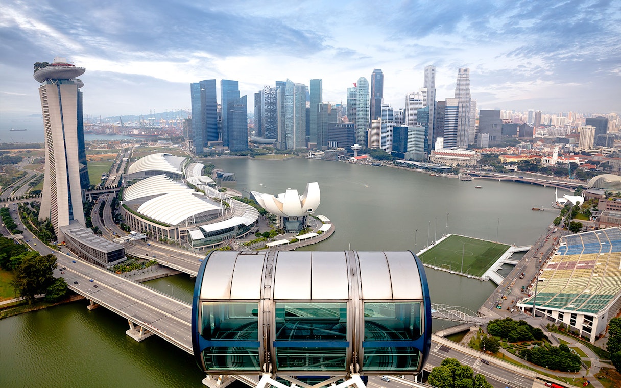 Singapore skyline view from the Singapore Flyer, featuring Marina Bay Sands and ArtScience Museum.