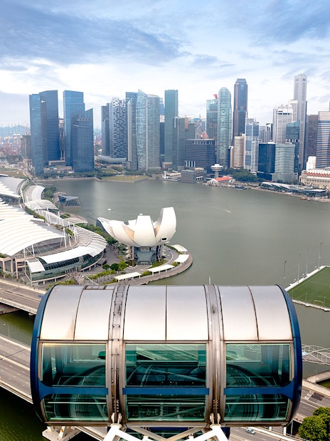 Singapore skyline view from the Singapore Flyer, featuring Marina Bay Sands and ArtScience Museum.
