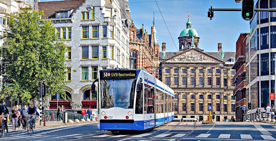 Tram in front of the Royal Palace in Amsterdam, part of the GVB Public Transport Pass.