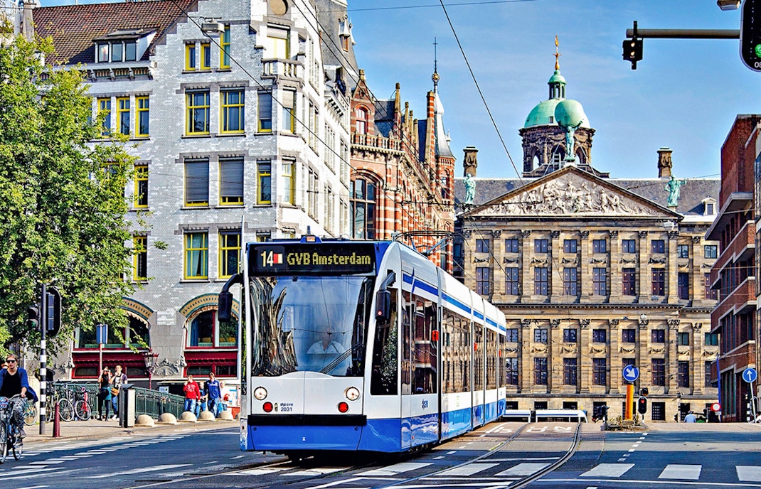 Tram in front of the Royal Palace in Amsterdam, part of the GVB Public Transport Pass.