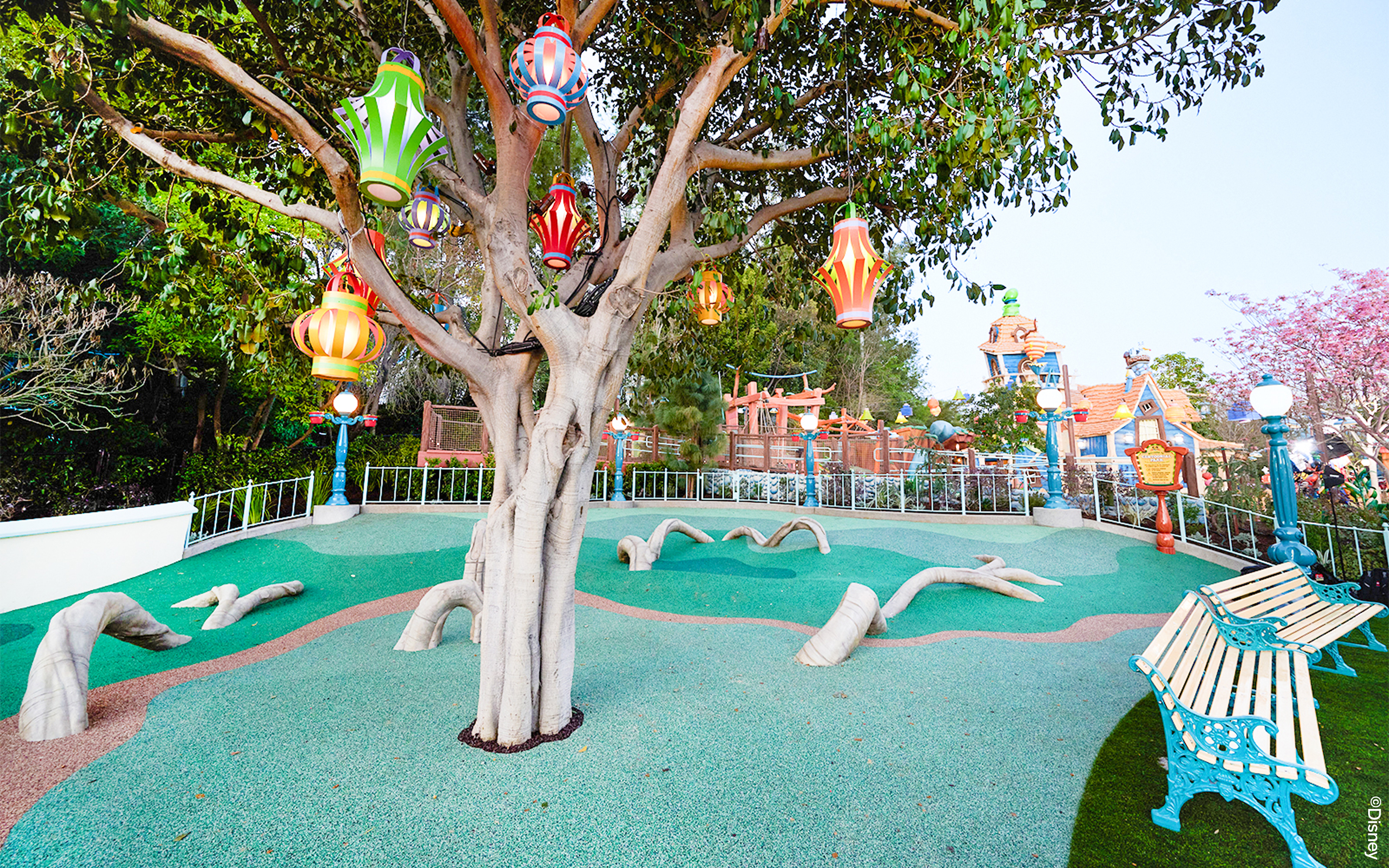 Colorful lanterns hanging from a tree in CenToonial Park, Disneyland Park California.