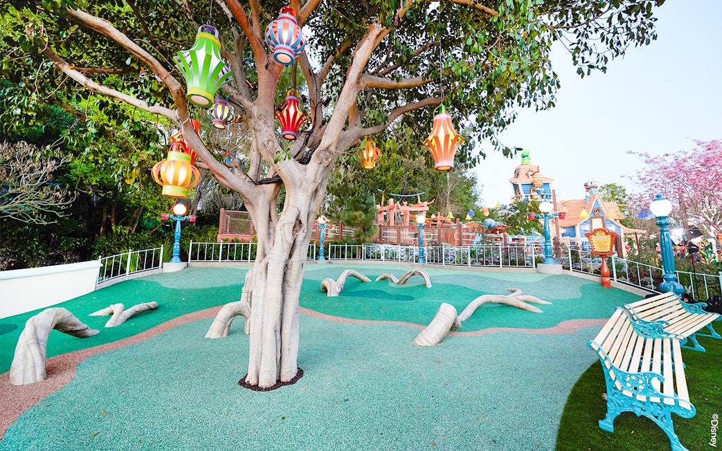 Colorful lanterns hanging from a tree in CenToonial Park, Disneyland Park California.
