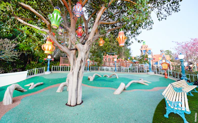 Colorful lanterns hanging from a tree in CenToonial Park, Disneyland Park California.