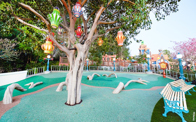 Colorful lanterns hanging from a tree in CenToonial Park, Disneyland Park California.